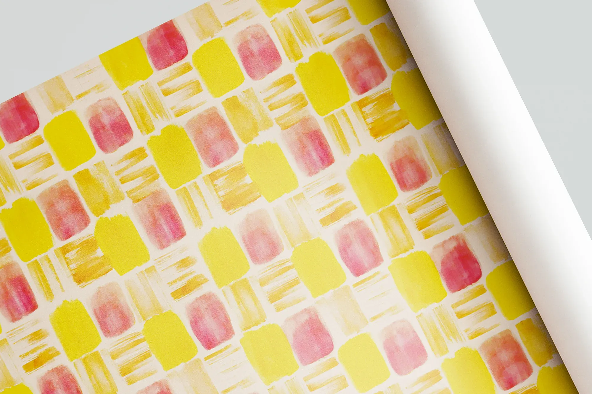 Wrapping paper with roughly painted block-like patterns in yellow and pink pigments.